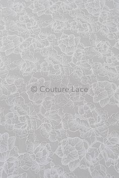 an image of white lace with flowers on it