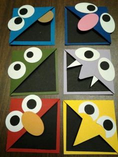 four different colored pieces of paper with eyes on them