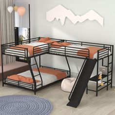 bunk beds with slide and ladders in a child's bedroom