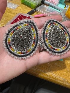 Handmade in Chiloquin Oregon. A beautiful shiny druzy tear drop shaped cabochon beaded with miyuki seed beads, leather backed and leverback findings. the measurements are in the photos.