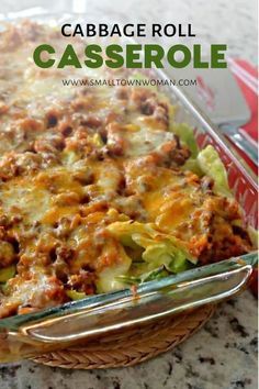 cabbage roll casserole in a glass dish with a serving utensil next to it