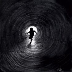 the silhouette of a person in a dark tunnel