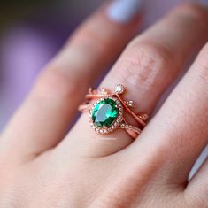 Gorgeous twisted vine emerald ring is made of 14k rose gold over 925 solid sterling silver, making a simple but elegant statement piece. Center Stone: EmeraldStone Creation: SimulatedColor: GreenShape: OvalGem size: 6.0 x 8.0 mmCarat Weight: 1.4 ct. (approx.)Hardness: 8 (Mohs scale)►Average band width: 2mm►Please be aware that plated jewelry can wear off over time, if this is a concern we would suggest going with the sterling silver or solid gold jewelry option.►Sold as a set.✓ Comfort Fit✓ Free Etsy Engagement Rings, Engagement Ring On Hand, Mohs Scale, Solid Gold Jewelry, Emerald Stone, Birthday Gift For Her, Fine Jewelry Collection, Emerald Ring, Unique Engagement Rings