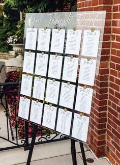 a sign that has been set up on the sidewalk for guests to sit down at