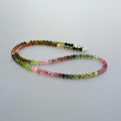 multicolored beaded bracelets on white background