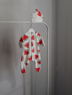 The watermelon sleepsuit will make the perfect outfit for a baby, and the perfect gift for lovers of fruits.  Your little ones will look super cute in their little dog babygrow and he looks adorable all year round! Details: 1. The babygrowe are 95% cotton,  5 elastan. 2. Long sleeved with fee 3. The sleepsuit is available in sizes newborn to 6-9 months making it a lovely baby's first birthday gift.  4. The watermelon design is on the around which looks really cute on new born babies and older. 5. White sleepsuit with red fruit. 6. Actual colors may very a little bit from those down due to individual monitor colors settings. 7. Please note that all items are handmade and unique, therefore pattern placements may vary slightly from the item pictured. The babygrow makes a beautiful new baby gi Playful Summer Onesie For Gifts, Playful Summer Onesie For Gift, Playful Summer Onesie As Gift, Playful Pink Onesie As A Gift, Playful Pink Onesie As Gift, Playful Onesie As Gift, Summer White Onesie For Bedtime, White Summer Onesie For Bedtime, White Summer Bedtime Onesie