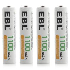 four batteries are lined up on a white surface