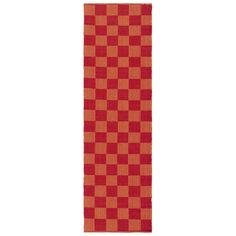 an orange and red checkered table runner