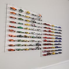 there are many toy cars on the wall