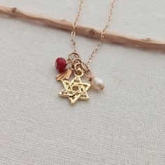 "Jewish necklace. Judaica jewelry. Dainty Magen David pendant. Gold star of David pendant. Women's gift. Jewish gift. 14K Gold filled. Hamsa hand. Protection jewelry Small 14K Gold Filled hamsa hand pendant. Paperclip 14K Gold Filled chain 1 ruby gemstone small bead, 1 freshwater pearl  This necklace measures in length 16\" + 1 inch extender chain You can choose your length! I include always a free surprise gift with every order All items are wrapped individually in a gift box Shipment arrives i Gold Charm Necklaces Perfect For Gifts, 14k Gold Jewelry With Star Charm Gift, Star Charm Pendant Jewelry Gift, 14k Gold Star Charm Jewelry Gift, Star Of David Necklace For Gift, Dainty Star Of David Charm Necklace For Gift, Gold Star Jewelry For Mother's Day, Spiritual Jewelry With Star Charm For Gift, Gold Star Of David Charm Necklace As Gift