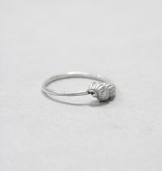 I live near the beach so seashells and pebbles always have a place in my shop. These seashells are exact copies of the real ones made in sterling silver with the lost wax casting technique. The seashell is approximately 10mm x 5 mm. This is a dainty ring that can be stacked along with others. You can choose to have it in plain silver or oxidised and brushed. Each ring is handmade to order and may slightly vary from the pictures. Please allow for subtle variations making each handmade piece uniqu Silver Shell Rings For Gift, Ocean-inspired Sterling Silver Jewelry For Wedding, Ocean-inspired Sterling Silver Jewelry For Weddings, Unique Silver Shell Rings, Ocean-inspired Silver Jewelry For Wedding, Silver Ocean-inspired Jewelry For Promise Ring, Silver Ocean-inspired Promise Ring, Handmade Silver Rings With Ocean-inspired Style, Ocean-inspired Sterling Silver Rings