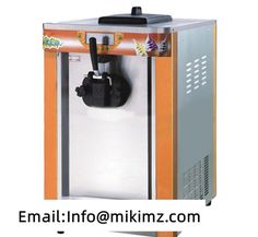 an orange and white ice cream machine sitting on top of a counter