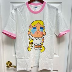 22in Width Under The Armpit 28in Length Shoulder To Bottom 100% Cotton T-Shirt. Super Soft Materials. Popmart Crybaby With Pink Edge Neck And Sleeves. Brand New, Never Worn. Up To 150lb. Only Cold Wash And Air Dry. White Cartoon Print T-shirt For Spring, White Graphic Tee With Character Print For Babies, White T-shirt With Cartoon Print For Spring, Kawaii White T-shirt For Summer, Unisex White T-shirt For Spring, White Kawaii T-shirt With Graphic Print, Cute White Cotton T-shirt, White Cotton Kawaii T-shirt, White Unisex T-shirt With Character Print