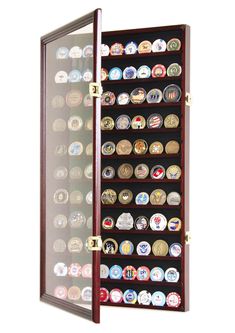 a wall mounted display case filled with lots of badges