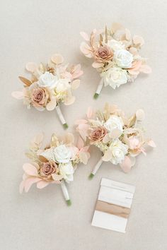 three bridal bouquets with pink and white flowers on top of each other next to an envelope