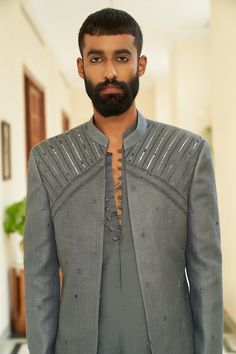 Lava Smoke Jacket Set - Contrast by Parth Made with pure silk weave and delicate texture. Adorned with metalliics Included in purchase:Jacket, Kurta and Pants Product Specification Color: Grey (can be customized) Fabric: Matka Silk Occasion: Formal Event, Wedding, Bridal, Reception Style: Jacket Set Designer: Contrast by Parth Care: Dry Clean Only Work: Hand Embroidered, Mirror ( Variation in color, fabric & detail is possible. Model images are only representative.) This can be customized in any Designer Embellished Bandhgala For Semi-formal, Designer Embellished Bandhgala For Semi-formal Occasions, Elegant Silk Outerwear With Zari Work, Festive Embellished Bandhgala For Semi-formal Occasions, Festive Embellished Semi-formal Bandhgala, Festive Semi-formal Embellished Bandhgala, Embellished Long Sleeve Bandhgala For Semi-formal Events, Embellished Long Sleeve Semi-formal Bandhgala, Designer Embellished Nehru Jacket