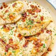 chicken with bacon and cheese in a skillet ready to be cooked on the stove