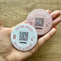 two badges that say i'm the bride and buy me a drink