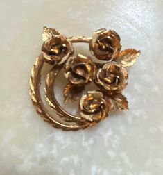 "This listing is for a vintage Coro gold tone floral brooch. It measures 2\" by 2\". In excellent condition. The shipping weight will be 2 ounces." Vintage Gold Flower Brooch, Vintage Gold Flower Brooches, Kitten Earrings, Plastic Bangles, Pink Plastic, Cat Pin, Brooch Pin, Headpiece, Clip On Earrings