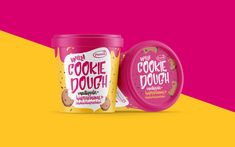 an ice cream container with cookie dough on it next to a pink and yellow background