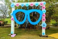 a blue and pink decoration with sunglasses on it