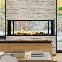 a modern fireplace in the middle of a living room