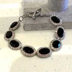 Excellent Like New Condition! Looks Like Never Worn. Bracelet Measures 7 1/4”. Really Nice! Check Out Other Items In My Closet! Over 3,000 Items- Mostly Jewelry ( But Not All)! Bundle For The Best Discount! ( 20% Off For 2 Or More Items). Smoke Free / Pet Friendly Home. Questions? Leave A Comment Below! Inv Note -J6518 Elegant Metal Crystal Bracelet With Stones, Elegant Black Metal Crystal Bracelet, Elegant Black Bracelets With Bling, Elegant Black Bling Bracelets, Monet Jewelry, Black Bracelets, Bracelet Silver, Black Crystals, Clear Rhinestones