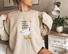 This fun Serious Goose sweatshirt makes the perfect gift for yourself or someone special! You may also love the Silly Goose option in our store, as well!  This Gildan sweatshirt is unisex and runs true to size. Many customers choose to size up 1-2 sizes for the popular oversized look.  Thank you for supporting my small business! Gifts Boho, Berry Good, Loretta Lynn, Boho Sweater, Quote Shirt, Christian Sweatshirt, Future Mrs, Bible Quote, Adam Sandler