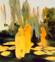 two women are standing in the water with lily pads