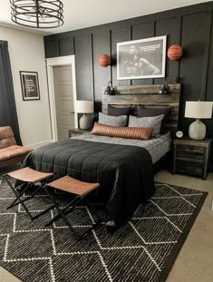 a black and white bedroom with wood accents