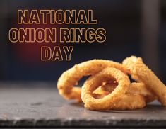 some onion rings are on a table with the words national onion rings day