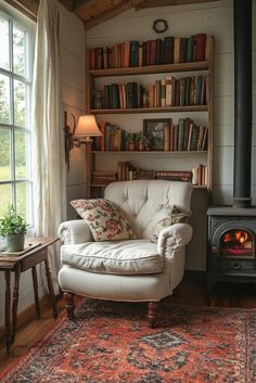 a living room with a chair, fireplace and bookshelf filled with books on shelves