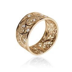 an intricately designed gold ring with diamonds on the inside, set in 18k yellow gold