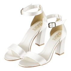 a pair of white high heeled sandals