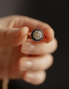 a person holding a ring in their hand