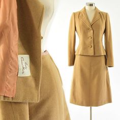 "Free Shipping. Free Returns. Everyday.* Tan baby camel hair & wool blend fabric Both pieces fully lined 3 button blazer with 3 button cuffs Unvented back A line skirt with hook/eye & zipper closure Pleated back hem Excellent pre-owned vintage condition Fits like a US modern size: Small or 6 (see size chart in photos) Chest: 38\" Shoulder: 15\" Length: 20.5\" Waist (skirt): 28\" Hip: 40\" Length: 23.5\"" Vintage Fitted Skirt Suit For Work, Vintage Notch Lapel Skirt Suit For Work, Vintage Fitted Skirt Suit With Notch Lapel, 1940s Skirt Suit, Vintage Single-breasted Long Sleeve Skirt Suit, 1950s Woman, Baby Camel, Plaid Cardigan, 50s Vintage