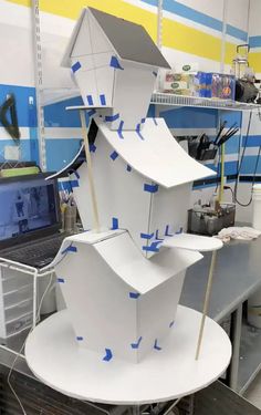 a large white sculpture sitting on top of a table