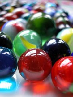 several different colored pool balls lined up together