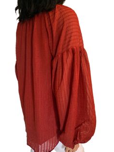 This Vermilion Lantern Sleeve V-neck Textured Blouse is perfect for any fall wardrobe. It features a stunning vermilion color, lantern sleeves, a v-neckline, and a lined bodice with a tassel tie finish. Whether you're dressing for an event or just a casual day out, it'll be sure to make a statement. 85% Viscose- 15%-Polyamide. Size Chart (INCH) Sizes Bust Sleeve Length Hem Relax Relax Back Relax S 40 27 25 44 M 43 28 26 46 L 45 28 27 48 XL 48 29 27 52 2XL 52 30 28 55 Elasticity None Elegant V-neck Peasant Top For Fall, Red Long Sleeve Blouse With Blouson Sleeves, Red Blouse With Blouson Long Sleeves, Fall V-neck Blouse With Blouson Sleeves, Orange V-neck Blouse For Party, Spring Red Blouse With Blouson Sleeves, Billowy Long Sleeve Blouse With Elastic Sleeves, Red Lantern Sleeve Blouse For Fall, Billowy Peasant Top With Lantern Sleeves And Gathered Details