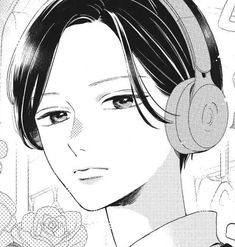 an anime character with headphones in front of flowers and roses on the wall behind him