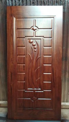 a wooden door with an intricate design on the front and side panels, made out of wood