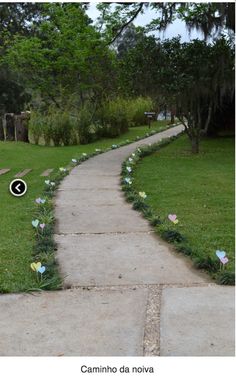 the path is lined with paper flowers and has an arrow pointing up to the left