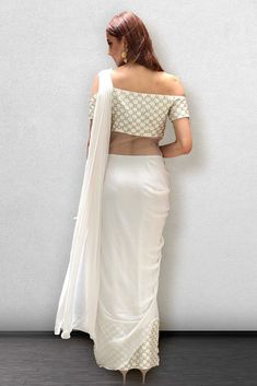 White Georgette Pre-draped Saree With Pearl Embroidery, White Georgette Blouse For Reception, White Traditional Drape Blouse For Reception, White Pre-draped Saree With Pearl Embroidery For Reception, Traditional White Pre-draped Saree With Pearl Embroidery, Elegant White Blouse With Traditional Drape, Elegant White Pre-draped Saree With Pearl Embroidery, Elegant White Pearl Embroidered Pre-draped Saree, Festive White Embellished Saree