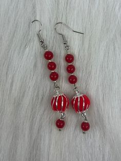 Hi Everyone,  Handmade Earrings, Red, Beads, Silver Petite Beads, Red, Pom Pom, Silver Dangle Earrings. Handmade fashion jewelry accessories perfect simple gifts for her or a special friend. So fun earrings.  Can be for everyday look for women and her fashion accessory. The length is about 3 inches from top to bottom.  Thank you for looking at my jewelry shop. Red Beaded Dangling Earrings As Gift, Red Dangling Beaded Earrings As Gift, Red Dangling Beads Earrings For Gift, Red Beaded Earrings For Gift, Red Wire Wrapped Dangle Earrings, Red Beaded Drop Earrings For Christmas, Red Dangling Beads For Party, Christmas Red Beaded Earrings With Colorful Beads, Christmas Red Beaded Earrings