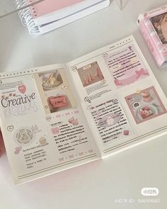 an open book with pink decorations on it