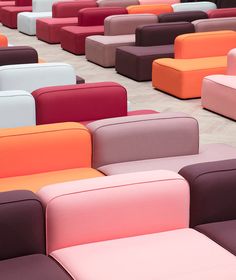 many different colored couches are arranged in rows