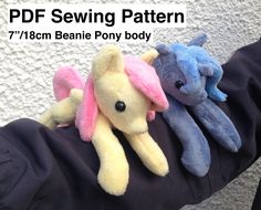 two stuffed animals sitting on top of someone's arm with the text pdf sewing pattern 7 / 18cm beanie pony body