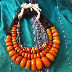 Three old Berber Necklace stone & Bead resin amber color, Ethnic Jewelry Morocco | eBay Bohemian Orange Beads For Jewelry Making, Bohemian Carnelian Jewelry In Orange, Bohemian Carnelian Orange Jewelry, Bohemian Orange Necklaces With Wooden Beads, Bohemian Orange Necklace With Wooden Beads, Traditional Orange Beaded Jewelry, Orange Carnelian Bohemian Jewelry, Vintage Amber Necklaces For Festivals, Traditional Orange Jewelry With Large Beads