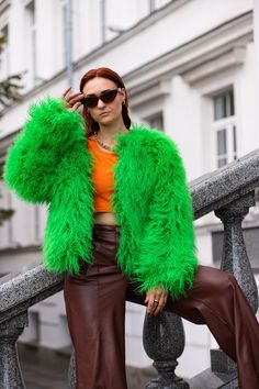 The shaggy green cropped jacket has soft, fluffy, wavy fur. During a walk or dance. or during the wind, the light hairs on the coat move as if alive and it looks beautiful and mesmerizing. The fur coat is short, has a round neckline. Green Faux Fur Coat For Fall, Green Long Sleeve Fur Coat For Winter, Winter Green Faux Fur Outerwear, Green Faux Fur Long Sleeve Outerwear, Green Faux Fur Outerwear With Long Sleeves, Green Fur Coat For Fall, Green Long Sleeve Fur Coat For Fall, Fluffy Long Sleeve Party Outerwear, Fluffy Winter Party Fur Coat