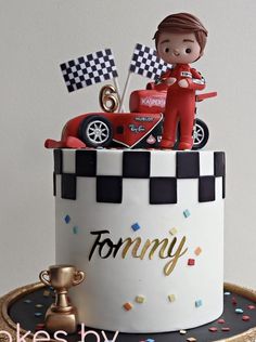 a birthday cake with a toy car on top